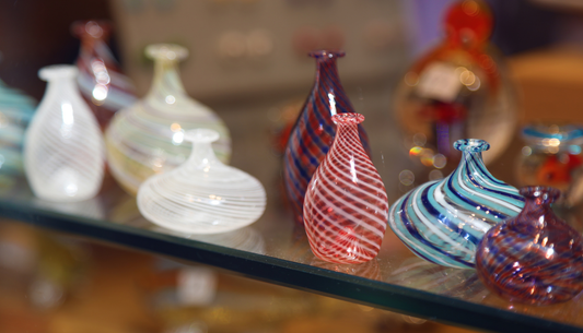 Why does handcrafted Liuli maintain higher resale value than machine-pressed glass?
